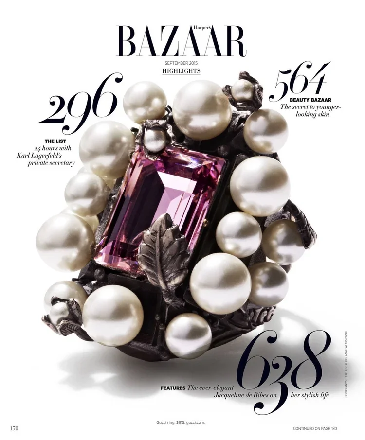 Cover of Harper's Bazaar September 2015 featuring a jewelry piece with a pink gemstone, pearls, and decorative leaves.