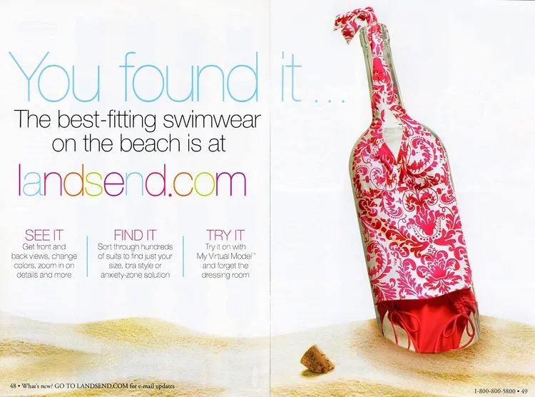 A decorated plastic water bottle with a pink and white floral pattern is placed in sandy terrain with small rocks, advertising landsend.com for swimwear shopping.
