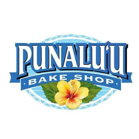 Logo of Punaluu Bake Shop featuring the shop's name in bold blue letters and a yellow hibiscus flower with green leaves beneath it.