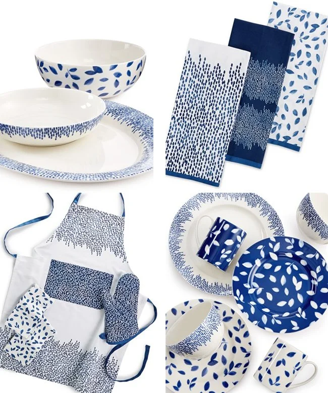 Blue and white patterned dinnerware and kitchen textiles, including bowls, plates, napkins, a mug, and an apron with leaf and dotted designs.