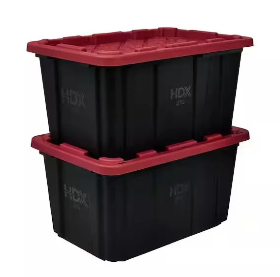 Two black plastic storage bins stacked, with red lids, used for organizing or storing items.