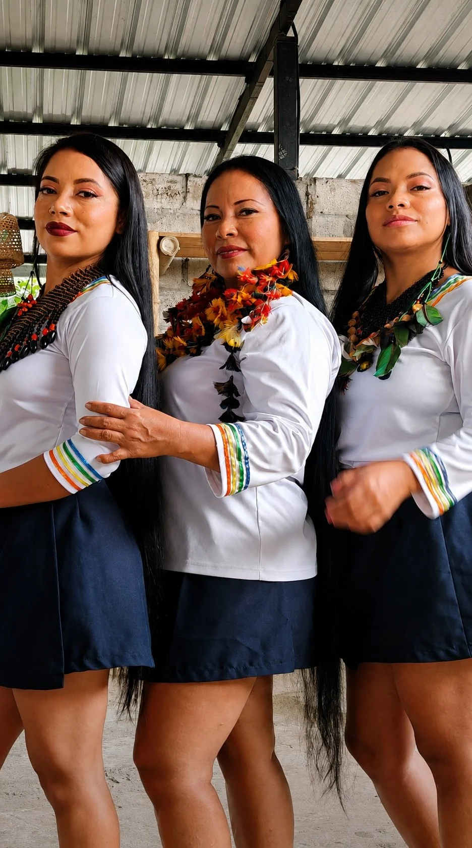 Samay Taki and her adult daughters wearing traditional attire, celebrating Indigenous culture and family heritage.