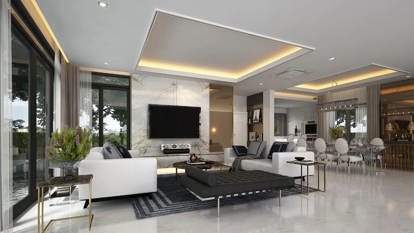 Modern living room with white sofas, a black tufted ottoman, a marble feature wall with a mounted TV, large windows with sheer curtains, and a dining area with a glass table and white chairs.