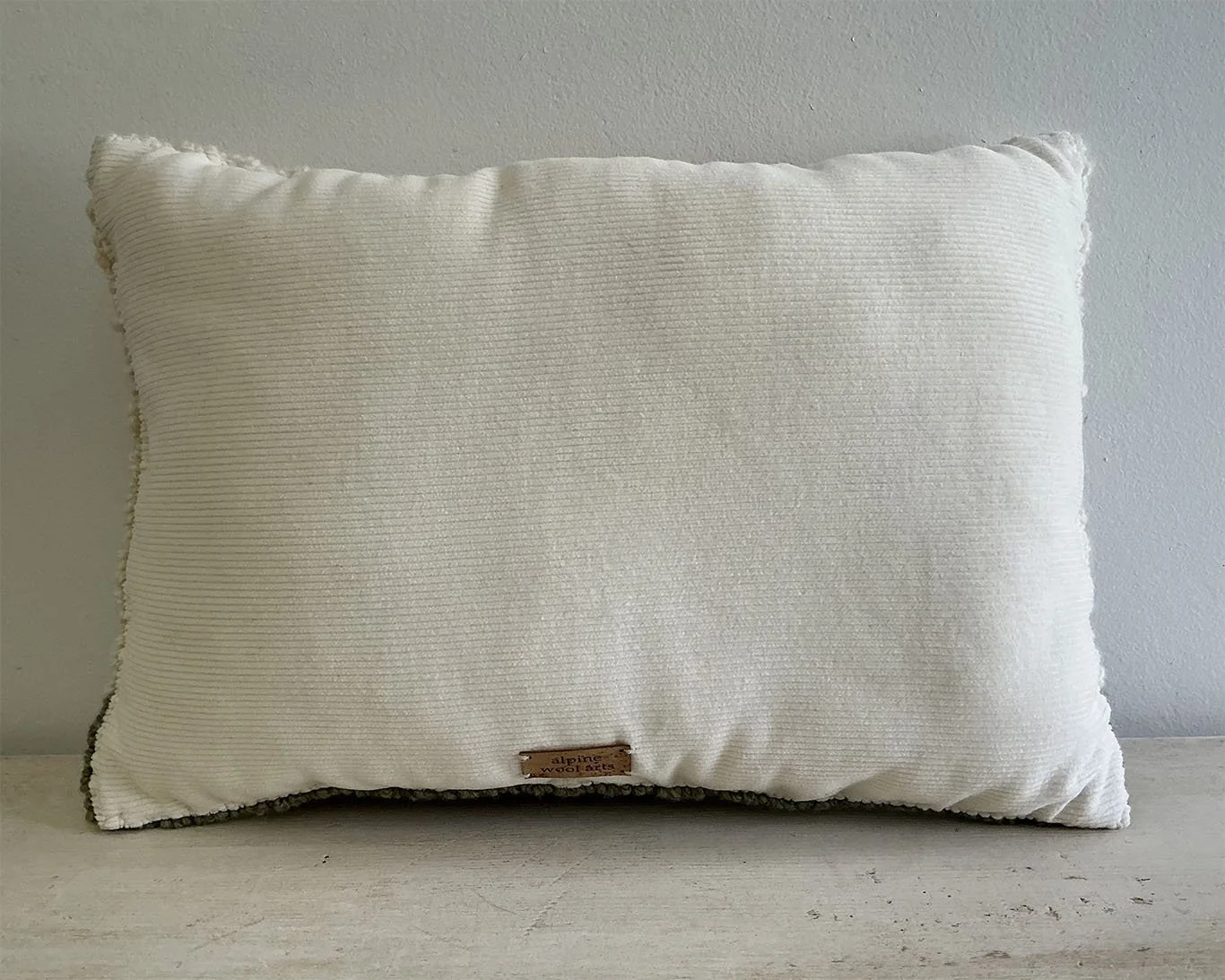 Back of pillow in ivory cotton corduroy.