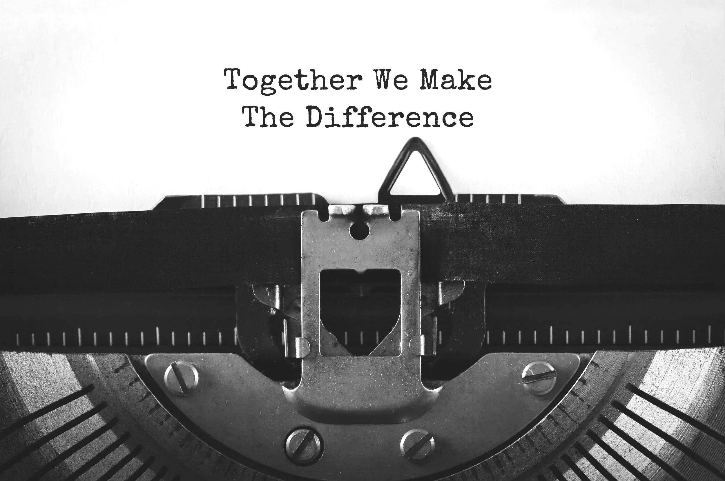 vintage typewriter with the words "Together We Make The Difference"