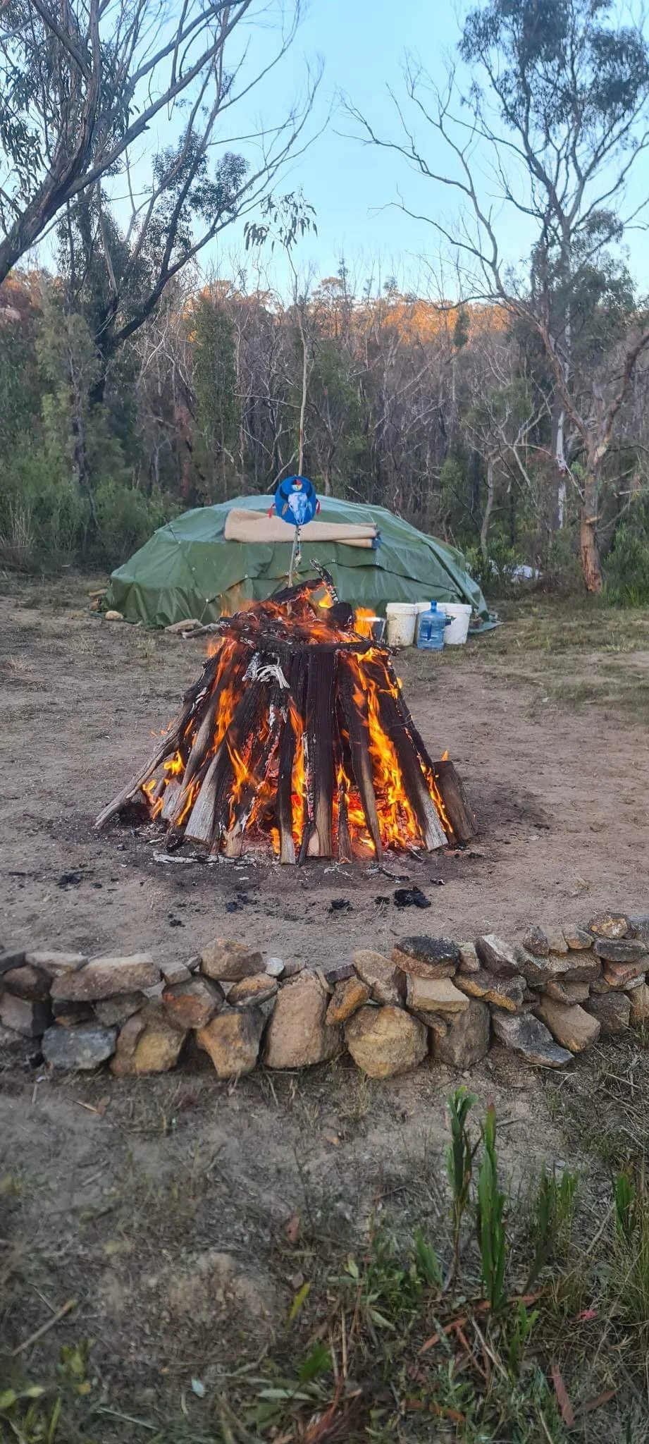 A sacred fire, campfire healing ceremony in front of a sweat lodge.
Sobriety, addiction and recovery support, health and wellbeing, mental and spiritual community.