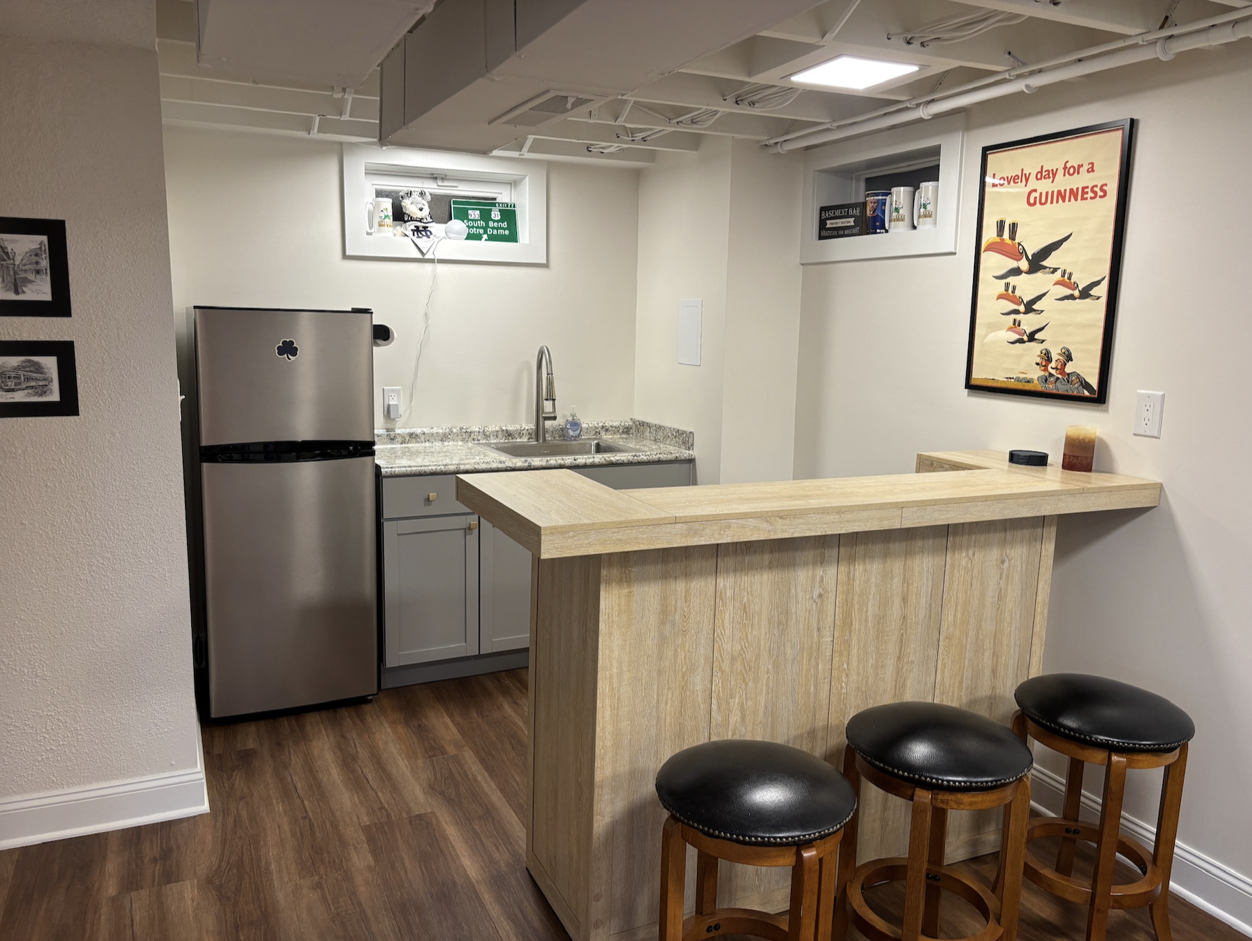 Basement bar with fully functional frudge and barstools