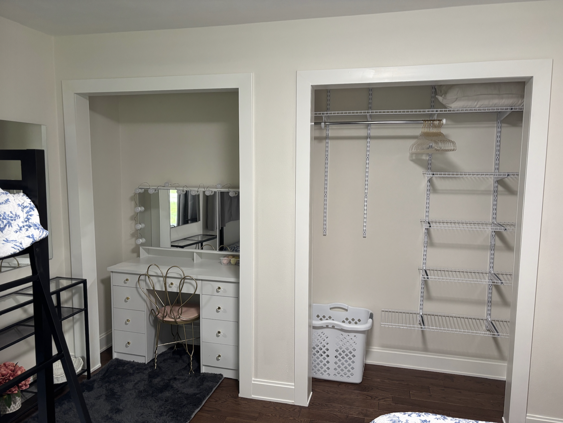 Double closet in second bedroom featuring lighted vanity 