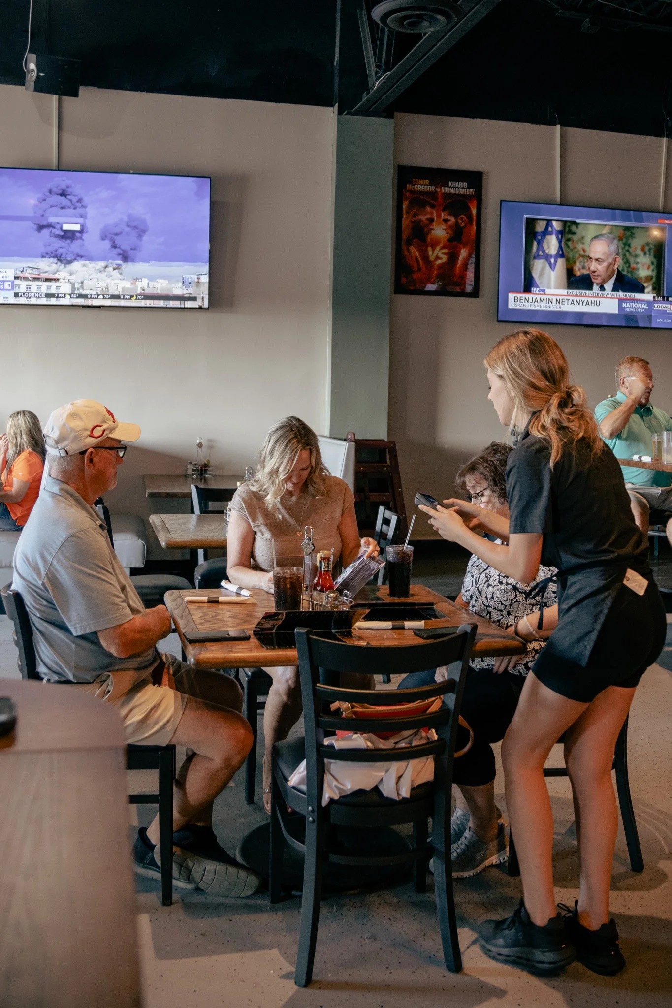 The Hangout waitress with customers 