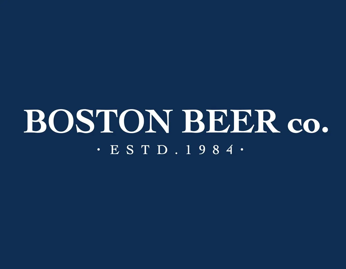 Logo of Boston Beer Co., established in 1984, on a dark blue background.
