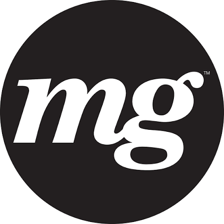 A black circular logo with white lowercase letters 'mg' in the center.