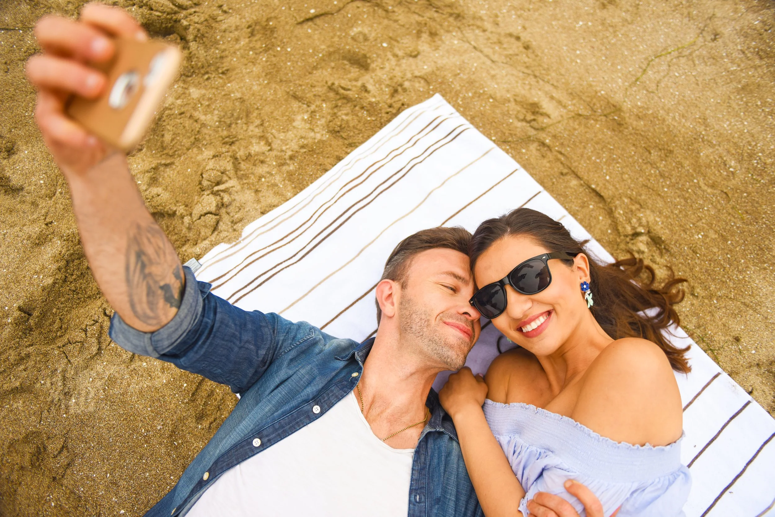 DSC_9635_Couple Laying Taking Selfie.jpeg