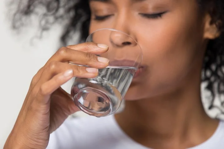 Image of woman drinking water