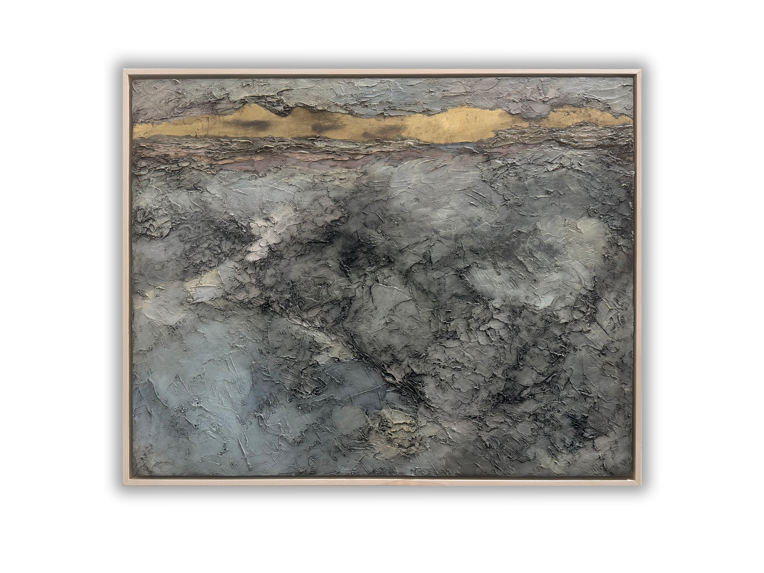 Abstract textured painting with shades of gray, black, and hints of gold in a wooden frame.