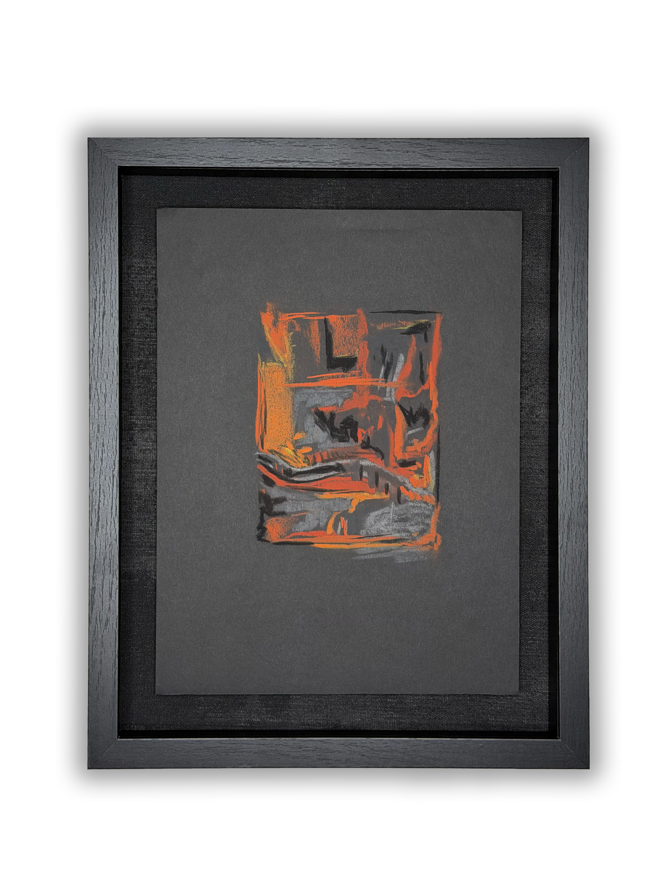 Abstract artwork with red and orange geometric shapes on black background, framed in black wood, mounted on white wall.