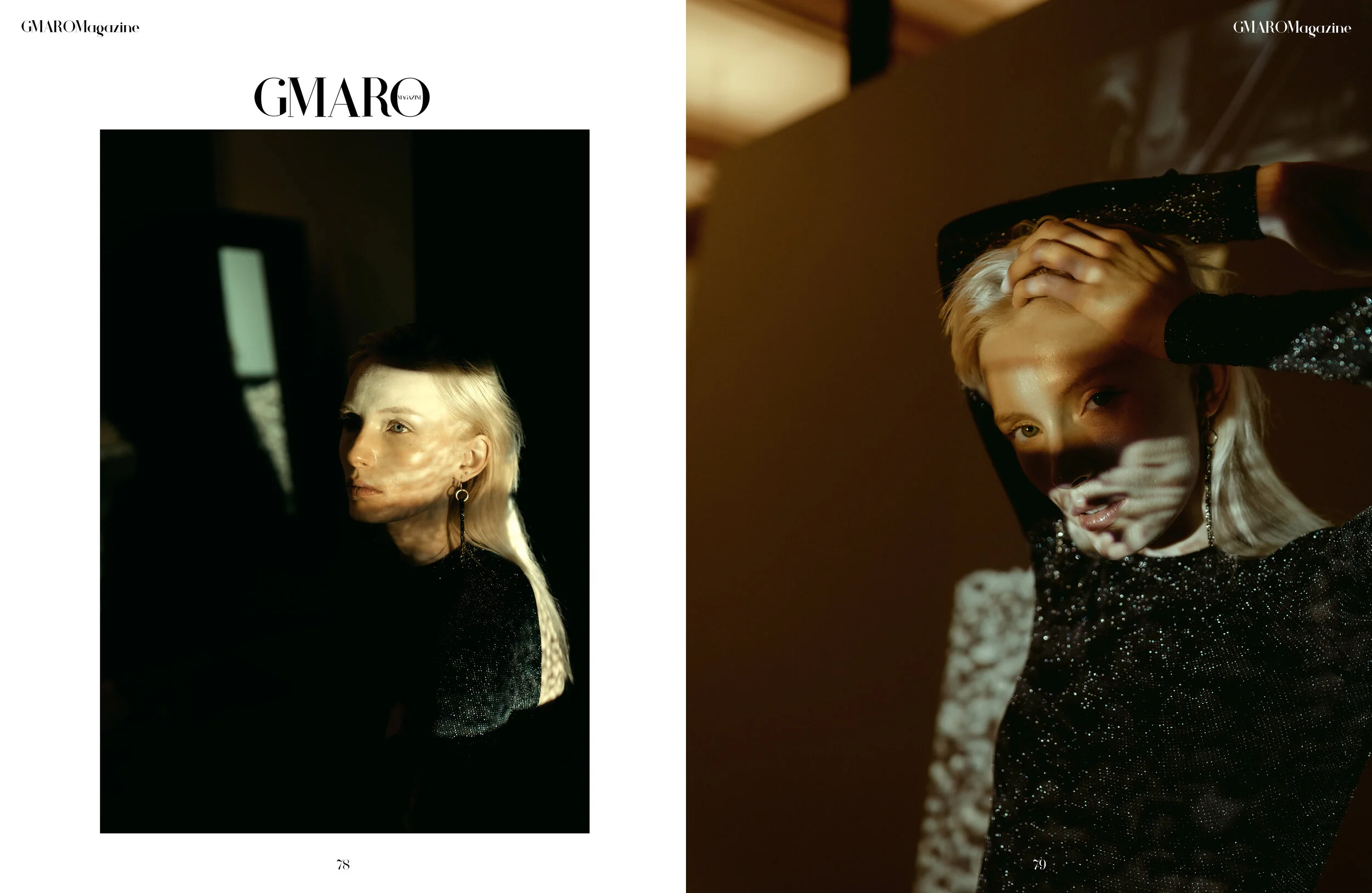 A person with platinum blonde hair and earrings, wearing a sparkly black top, sitting in a dark room with sunlight creating shadows on their face, and another person with light hair and similar attire, raising their arm over their head in a dimly lit