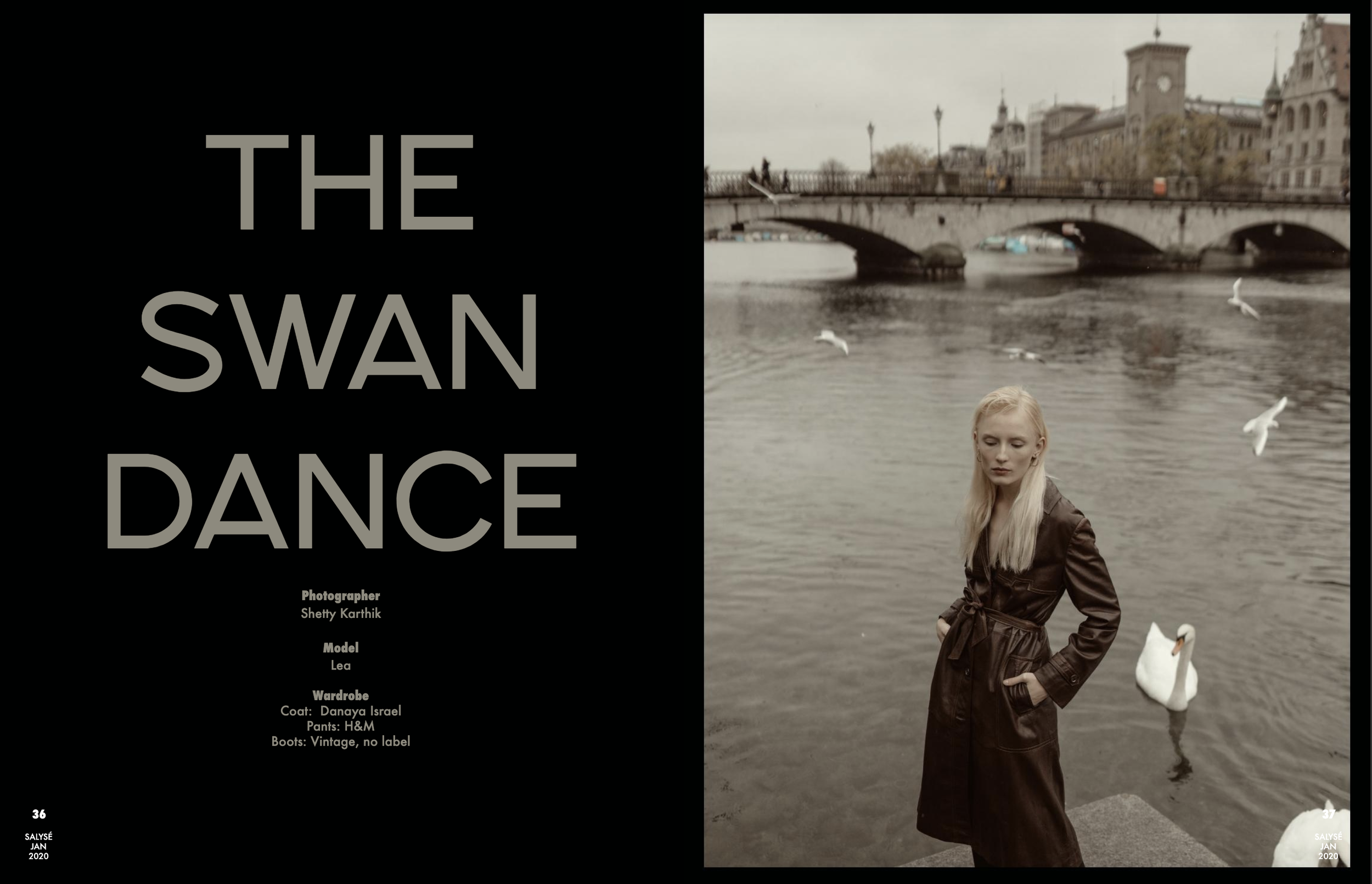 A magazine spread with the title 'The Swan Dance' on the left page, featuring the photographer Shetty Karthik and model Lea, wearing a brown coat by Danaya Israel, pants from H&M, and vintage boots, standing by a river with swans, a bridge, and histo
