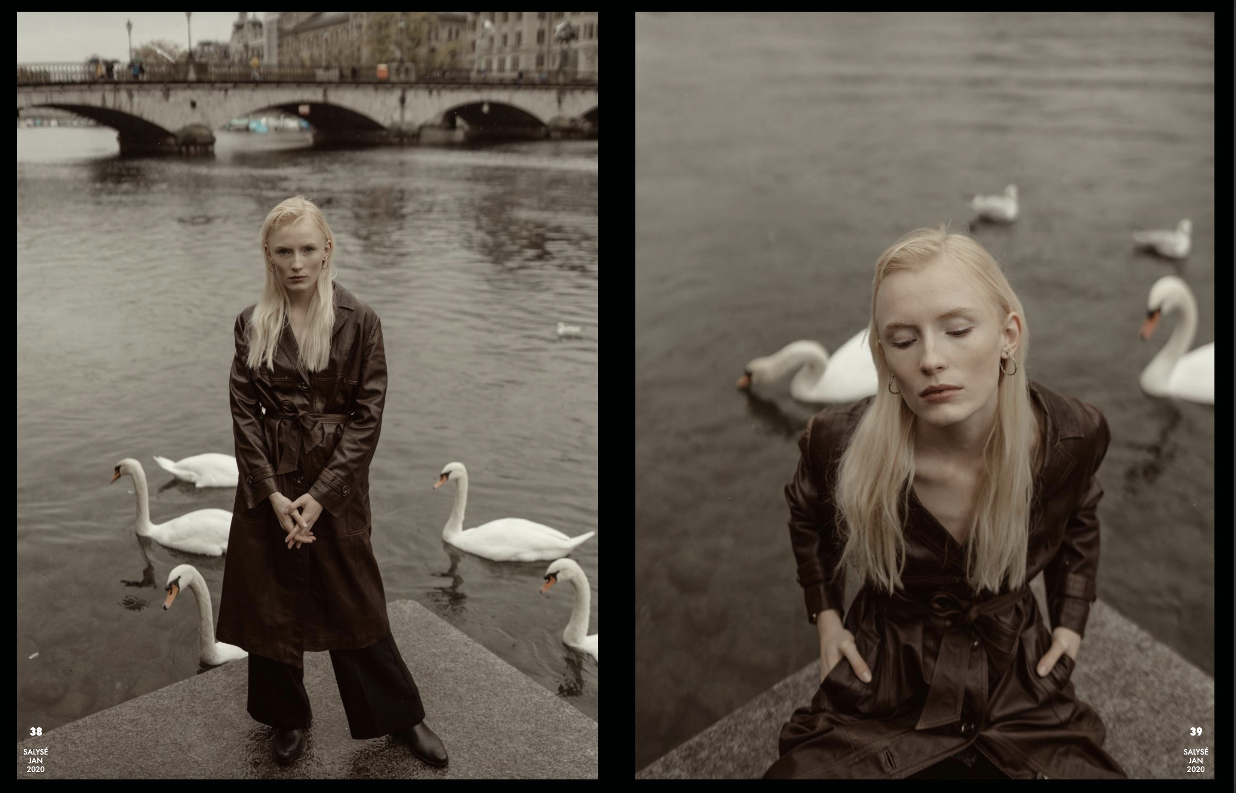 Side-by-side photographs of a blonde woman with a leather jacket in front of swans on a river, with urban buildings and a bridge in the background. One photo shows her standing upright with her hands clasped in front, while the other has her with eye
