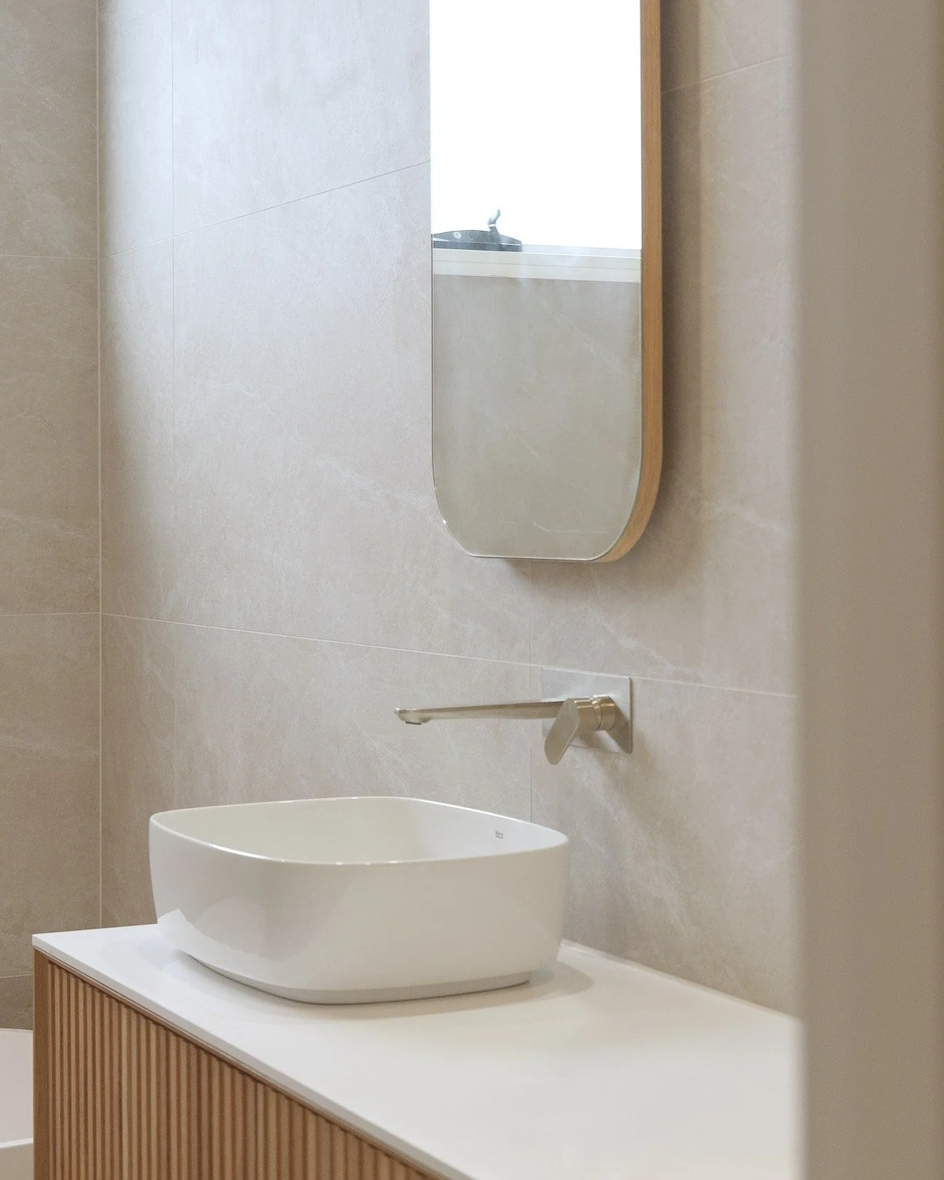 Refined, functional, and built to last.

Clean lines, warm textures and considered finishes come together to create a bathroom that feels both modern and timeless.

Every element, from lighting to joinery, has been designed to sit seamlessly within t