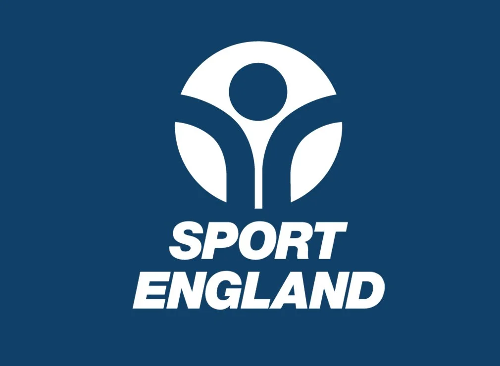 Logo with stylized human figure and the text "SPORT ENGLAND" on a dark blue background.