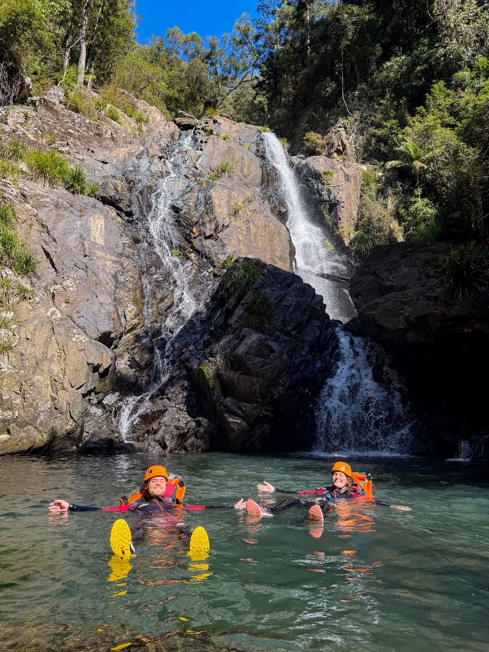 Two canyoners enjoying a pool below a Bangalore waterfall