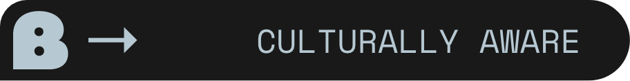 Black button with light blue text reading 'Culturally Aware' and a light blue arrow pointing right.