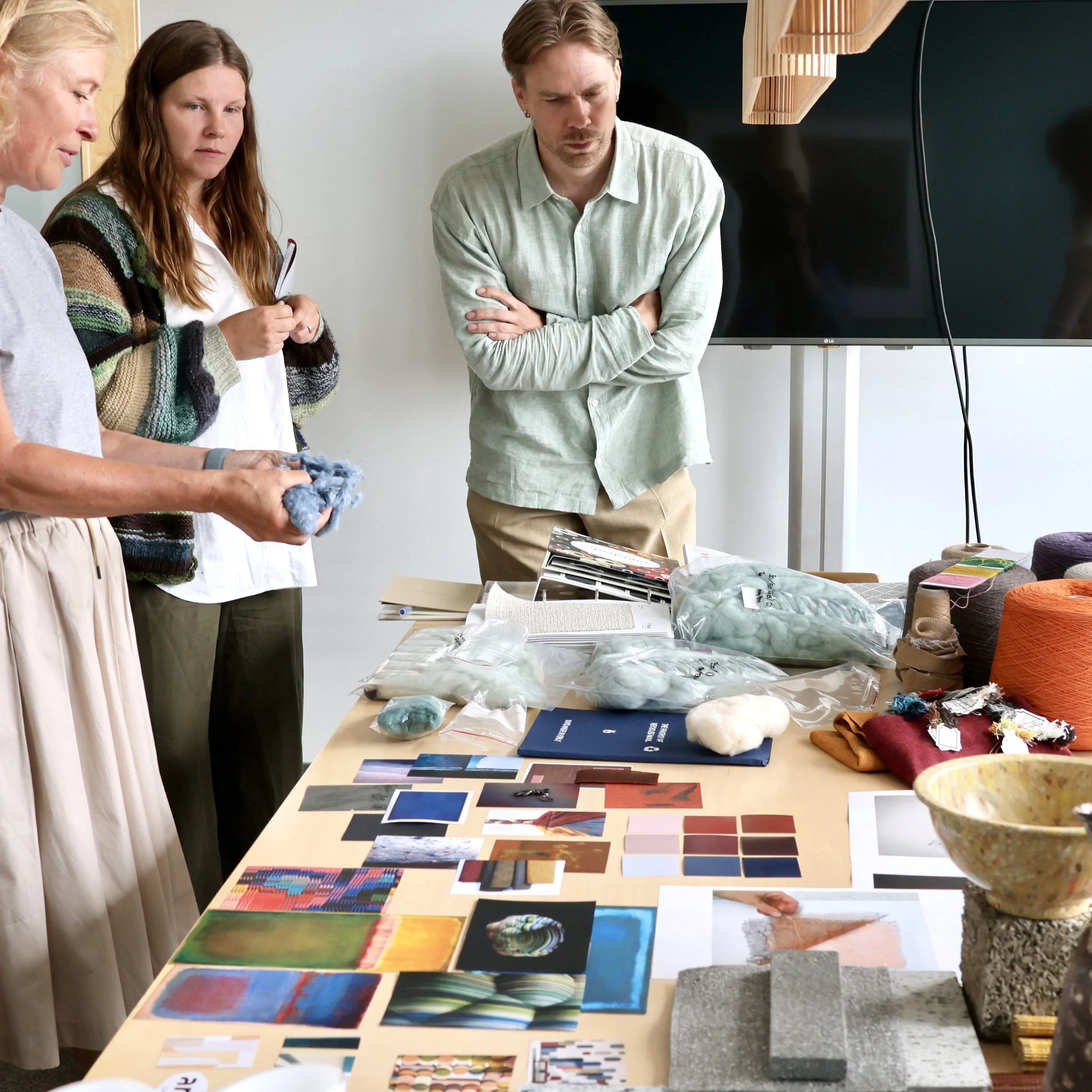 The MELANGE identity building wasn't only theoretical, it was built through physical samples. Materiality is at the core of the project.

Samples produced in the lab were passed around the room: unbleached virgin cotton, mechanically recycled cotton 
