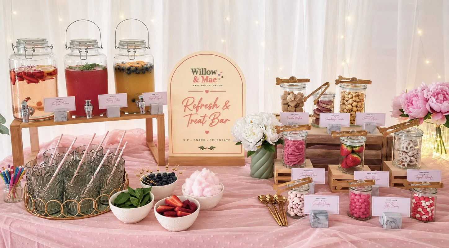Refresh & Treat Bar with drink dispensers, fresh fruit garnishes, sweets and a Willow & Mae sign