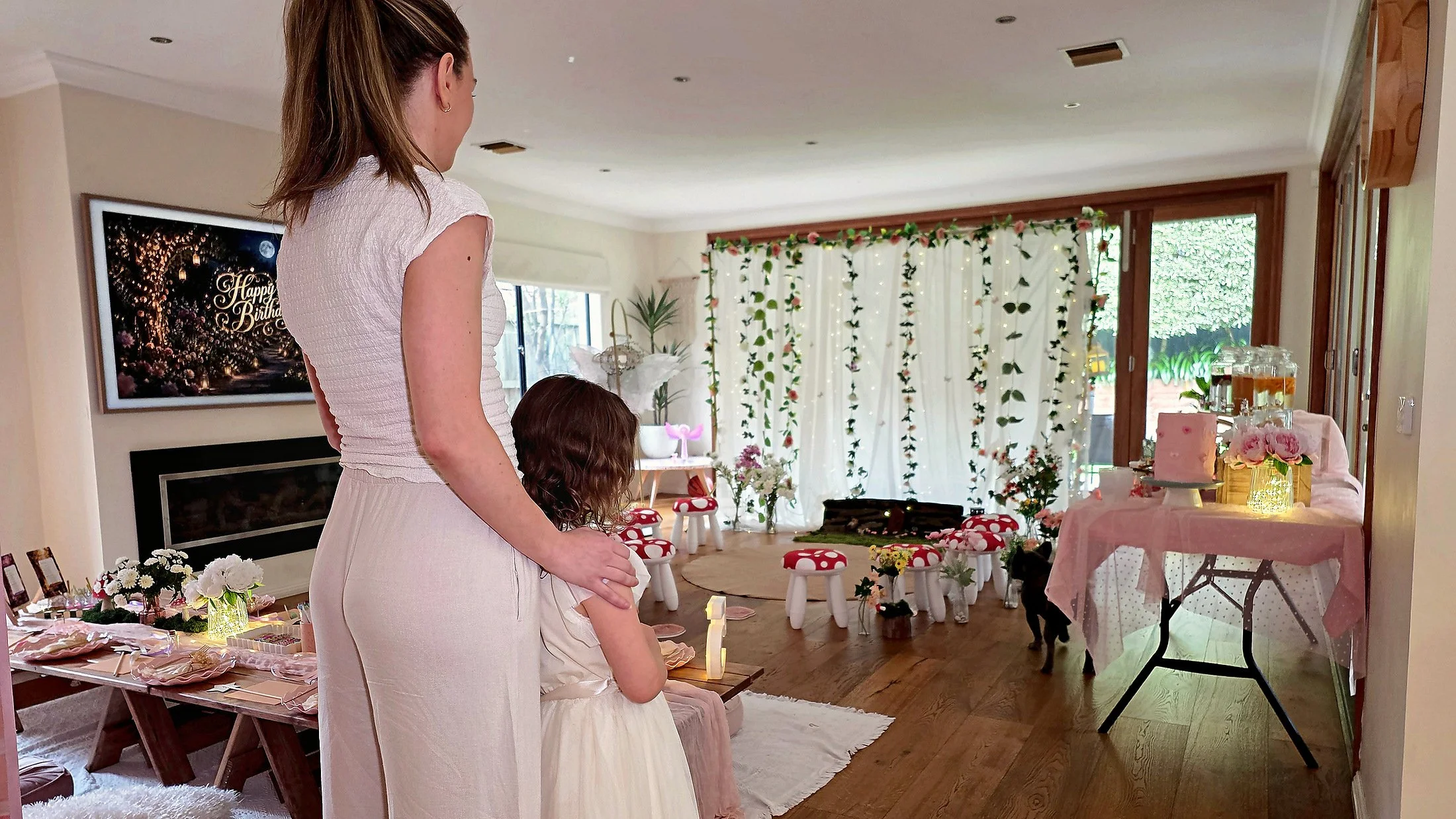 Mother and daughter pausing in the doorway before stepping into an Enchanted Garden fairy party
