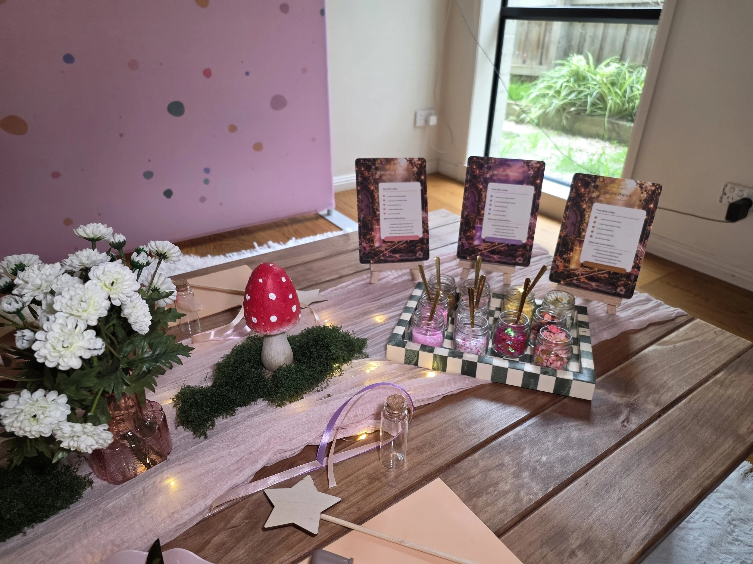 Fairy potion-making station with recipe cards, potion ingredients and toadstool decor