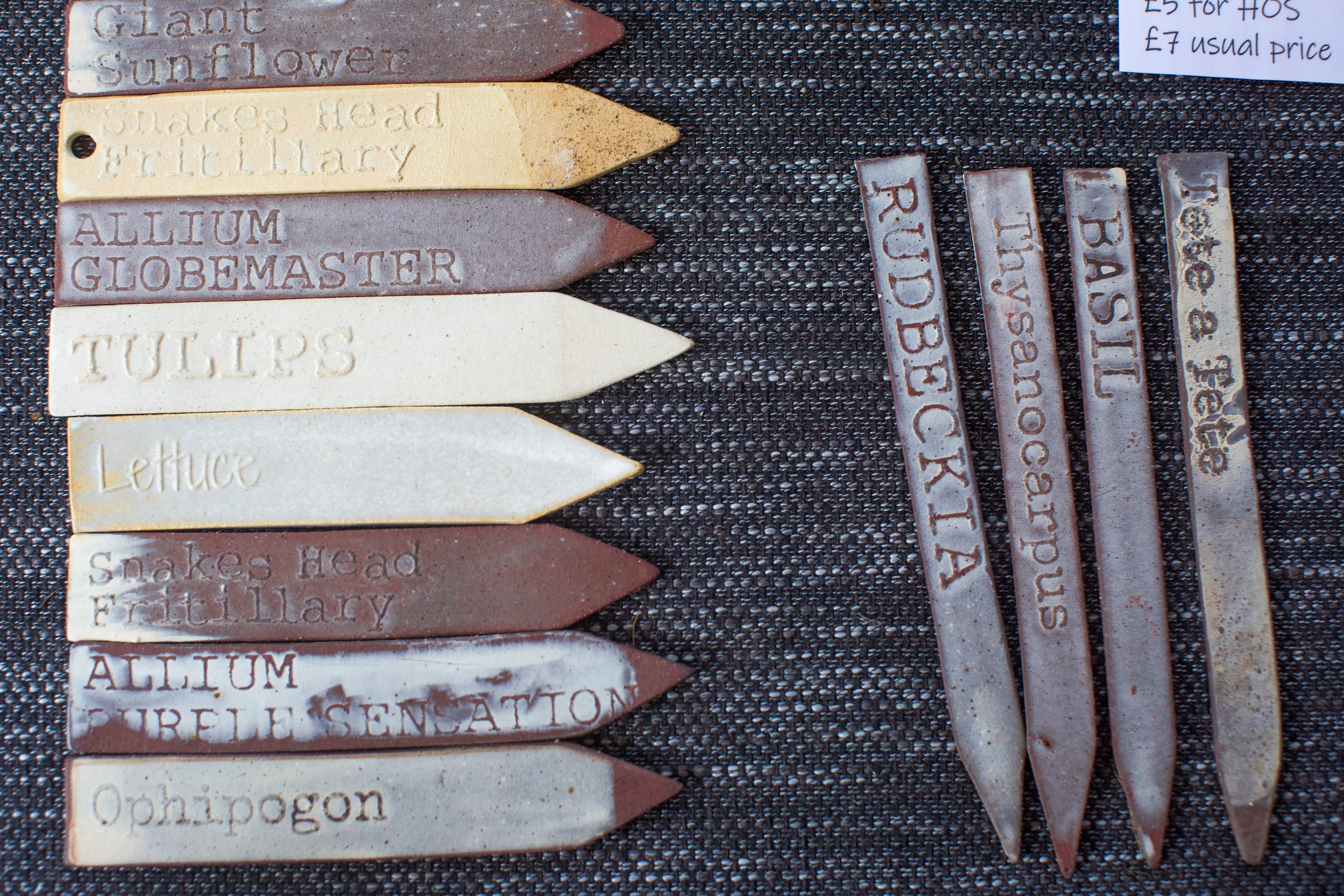 Handmade ceramic plant labels for Rudbeckia, Basil and other plants, displayed for sale with pricing