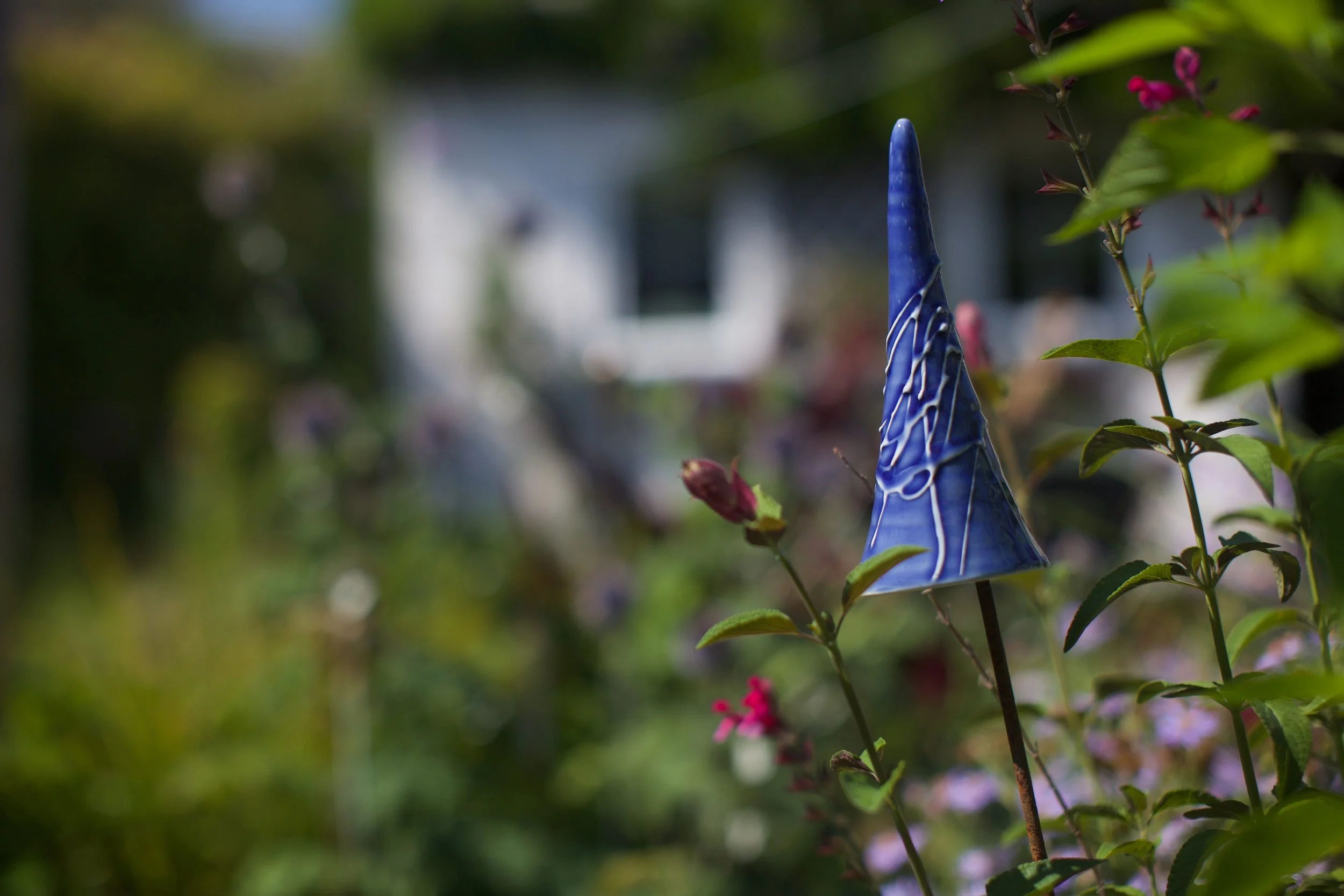 Handmade ceramic mushroom cane topper in blue, by Sheena Bond