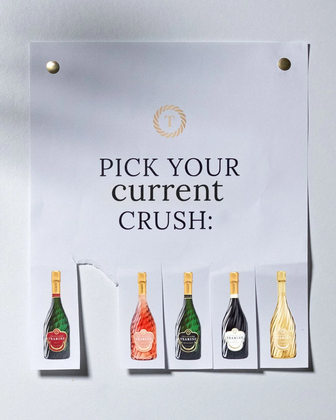 Affiche avec la phrase 'Pick your current crush' et cinq petites bouteilles de champagne de différentes couleurs en dessous.