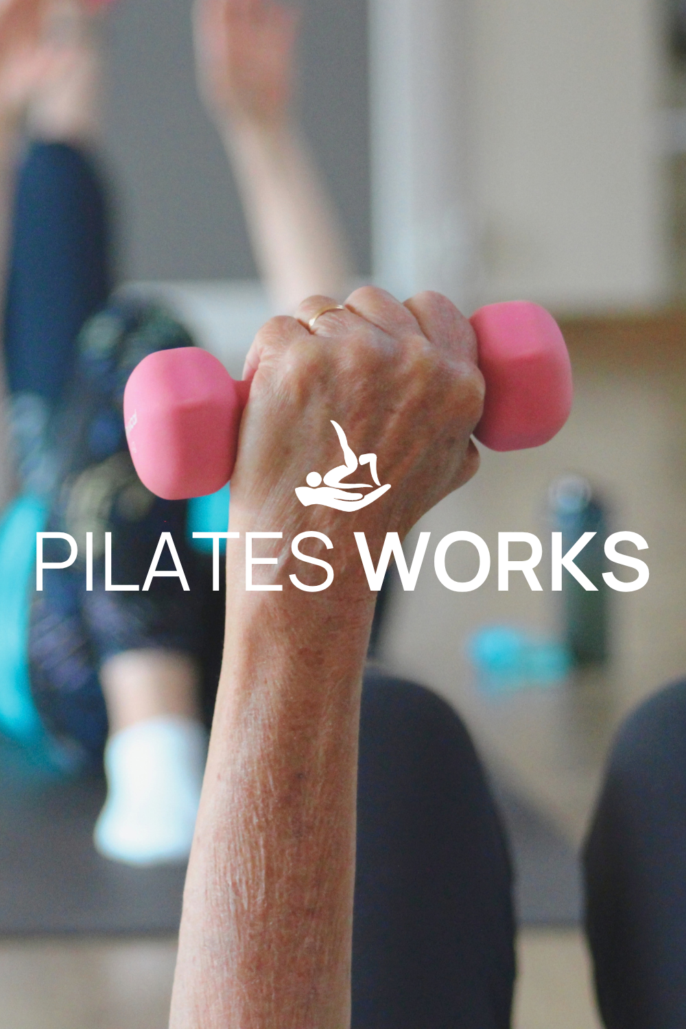 Close-up of an elderly person's hand holding a small pink dumbbell during a Pilates workout, with the logo and text 'Pilates Works' overlayed.