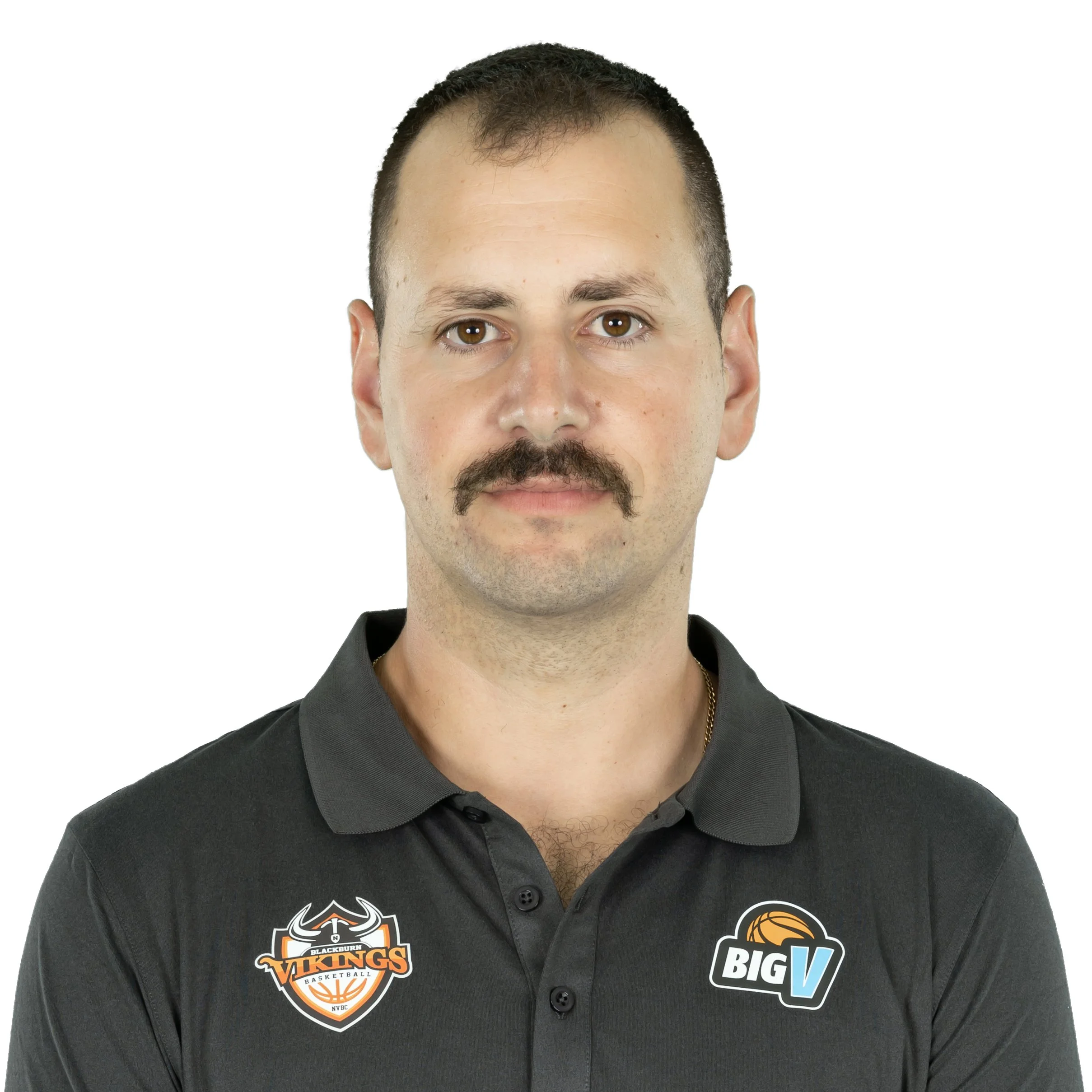 A man with light brown hair and a mustache, wearing a black shirt with logos including Vancouver Vikings basketball, Blackburn, and Big V, against a white background.