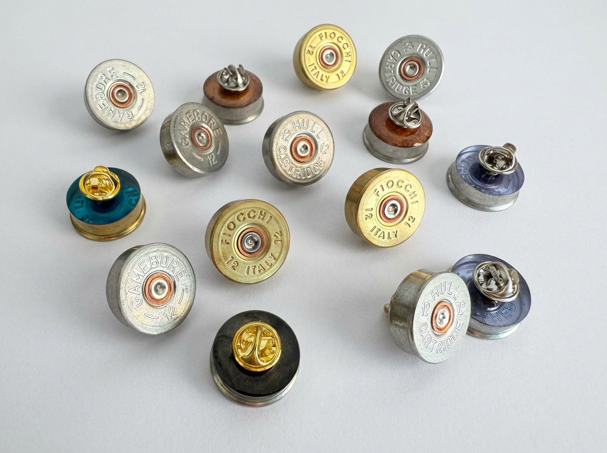 Set of 9 Epoxy-Filled Cartridge Cap Pin Badges