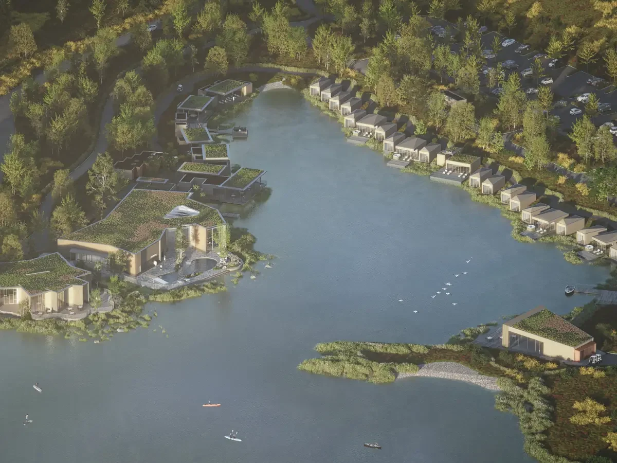 Aerial view CGI of Silverlake Dorset showing lakeside buildings with green roofs integrated into the surrounding landscape.