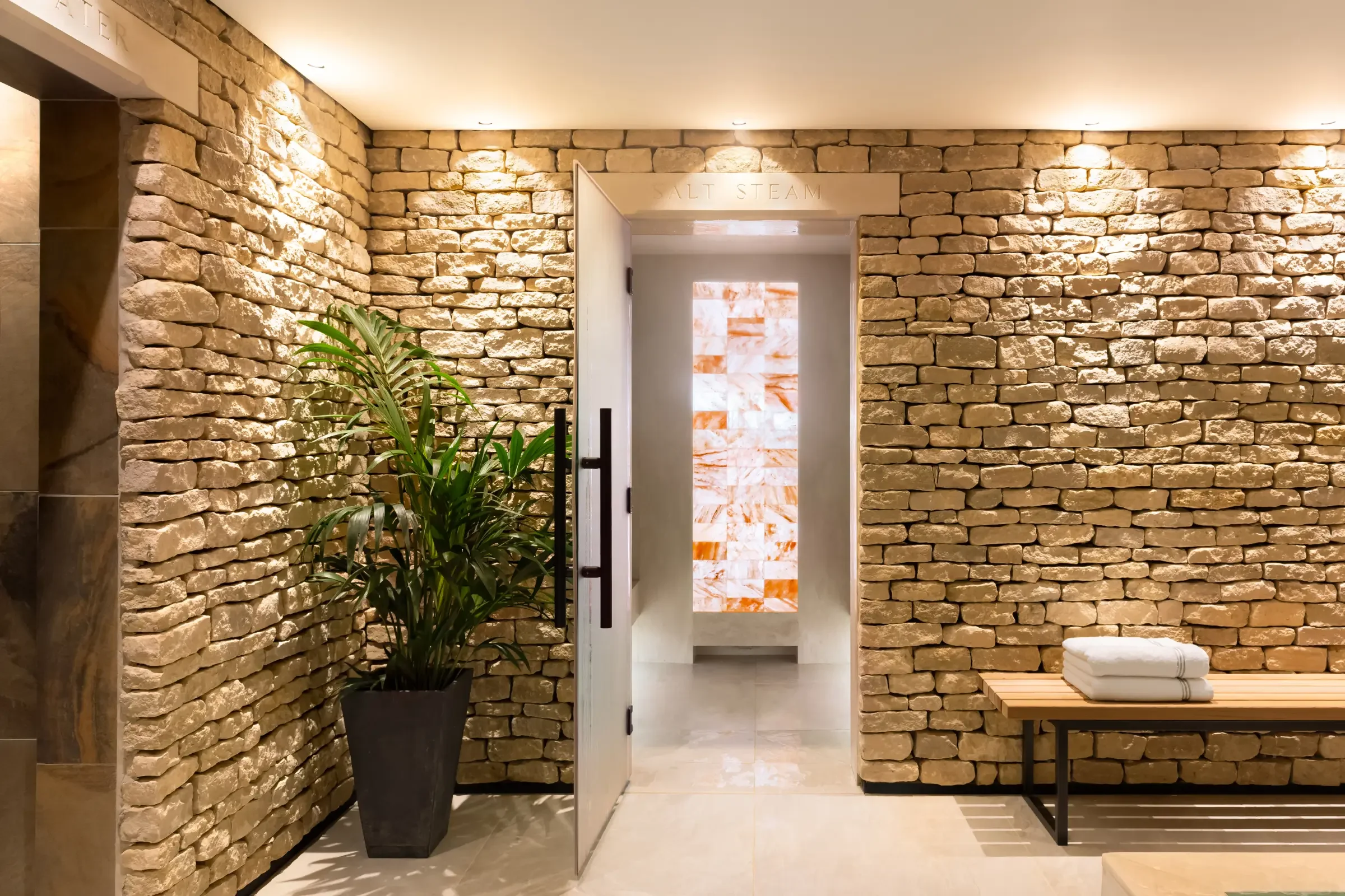 Himalayan salt steam room at Homefield Grange, surrounded by traditional local dry-stone walling.