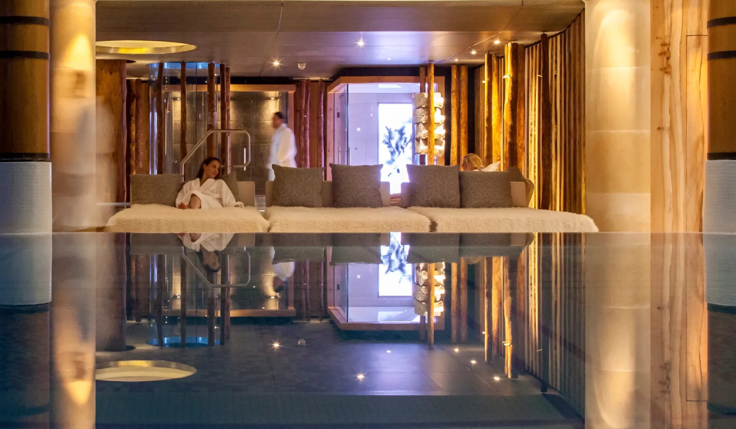 relaxation.jpg  Poolside relaxation daybeds with the thermal suite beyond at Champneys Forest Mere