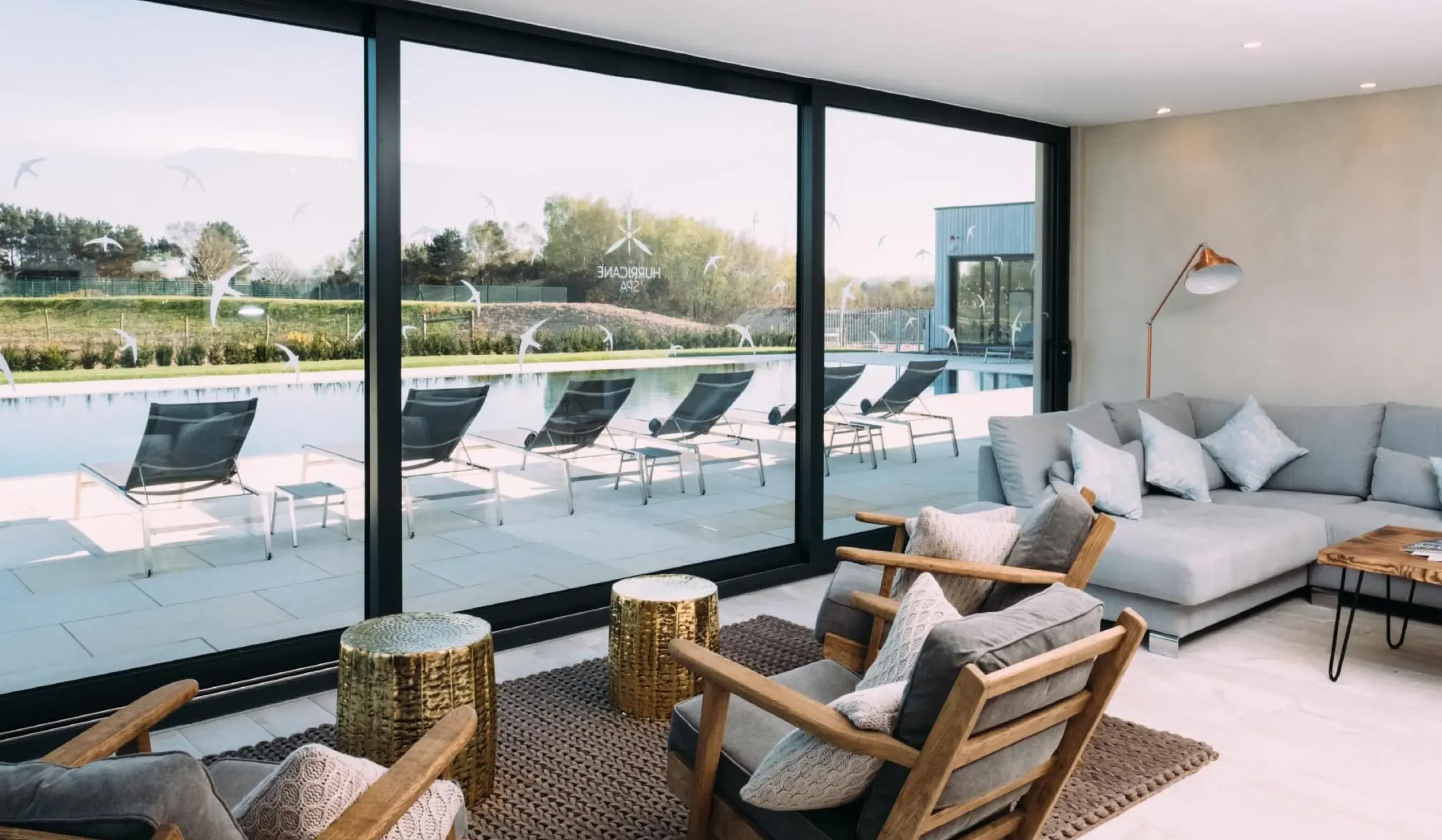 Silverlake Spa reception lounge and waiting area with relaxed seating overlooking the outdoor pool.