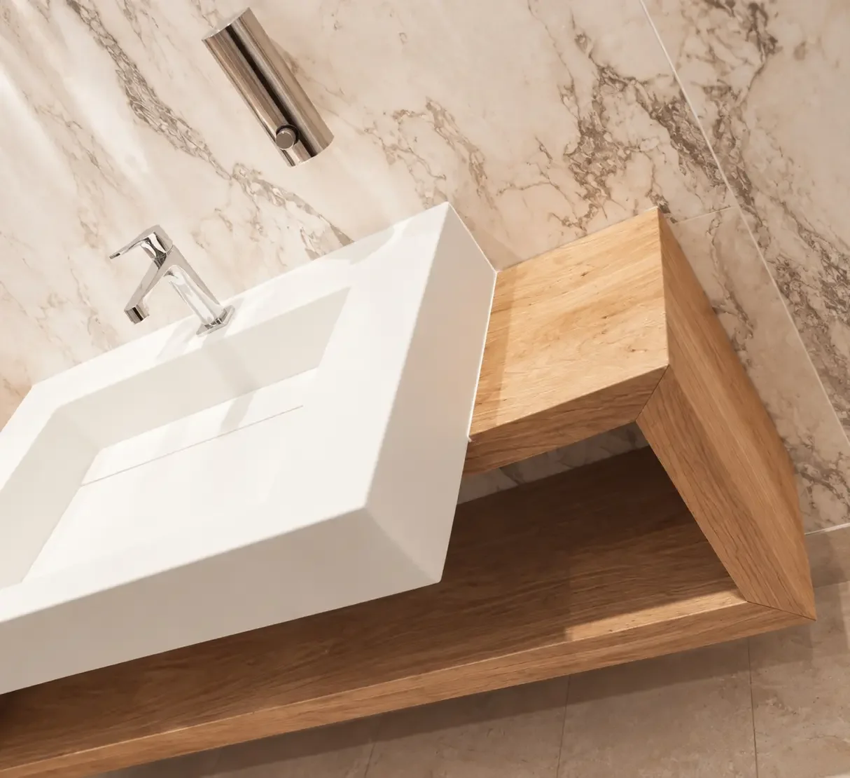 Bespoke timber vanity unit with contemporary basin and natural stone finishes in the spa changing area.