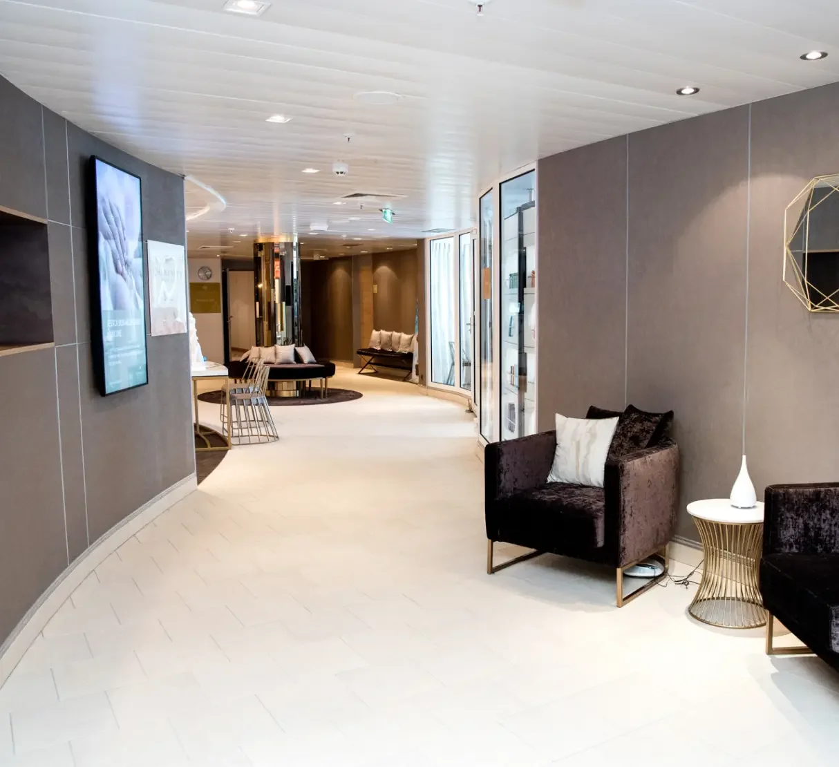 Champneys spa waiting area with soft seating and bespoke interior detailing.