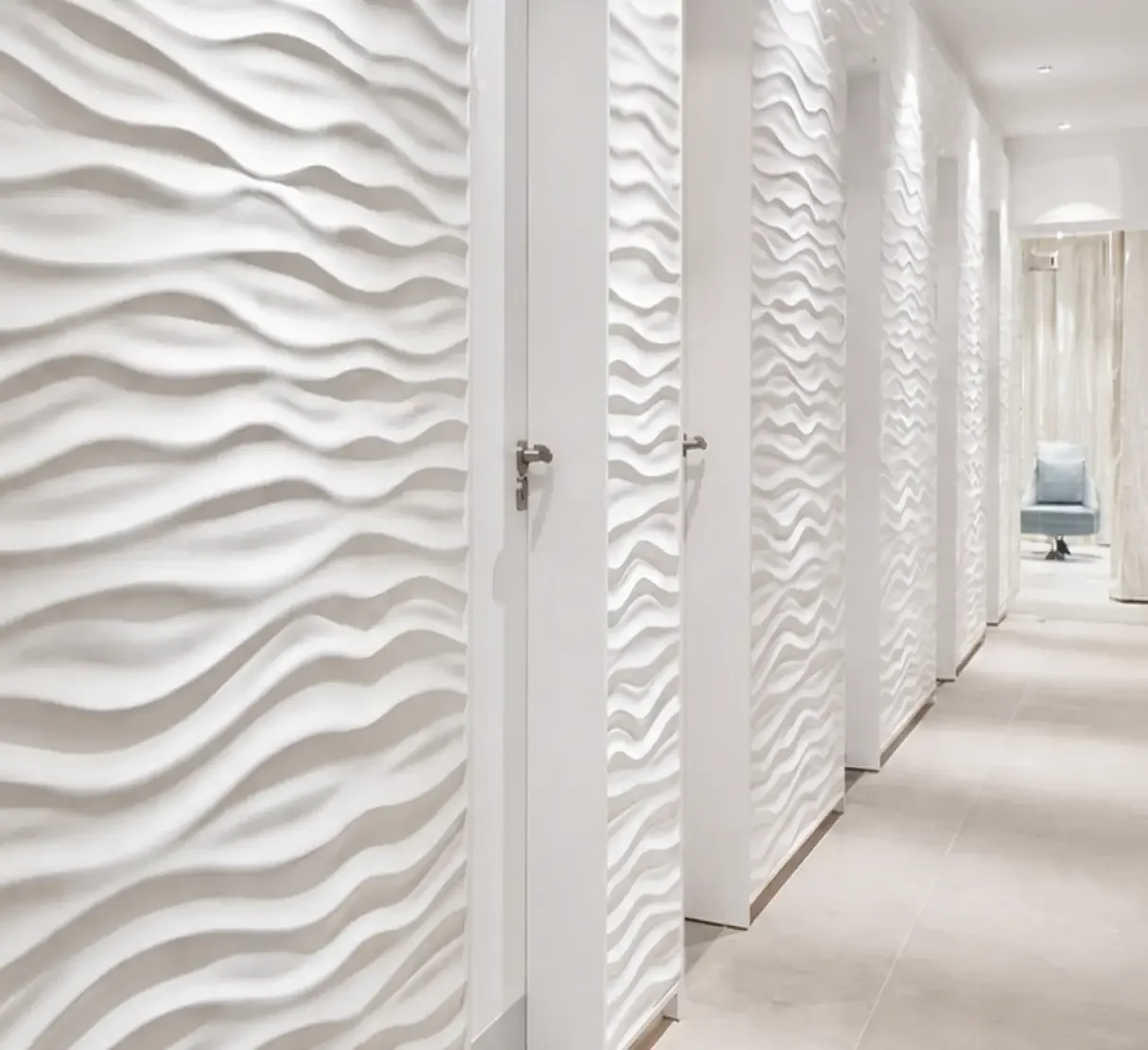 Corridor with sculpted wave wall panelling at Champneys Tring
