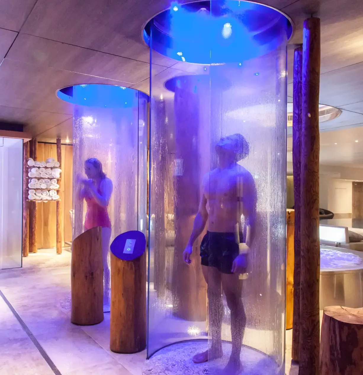 Guests using the immersive experience showers in the Forest Mere thermal suite