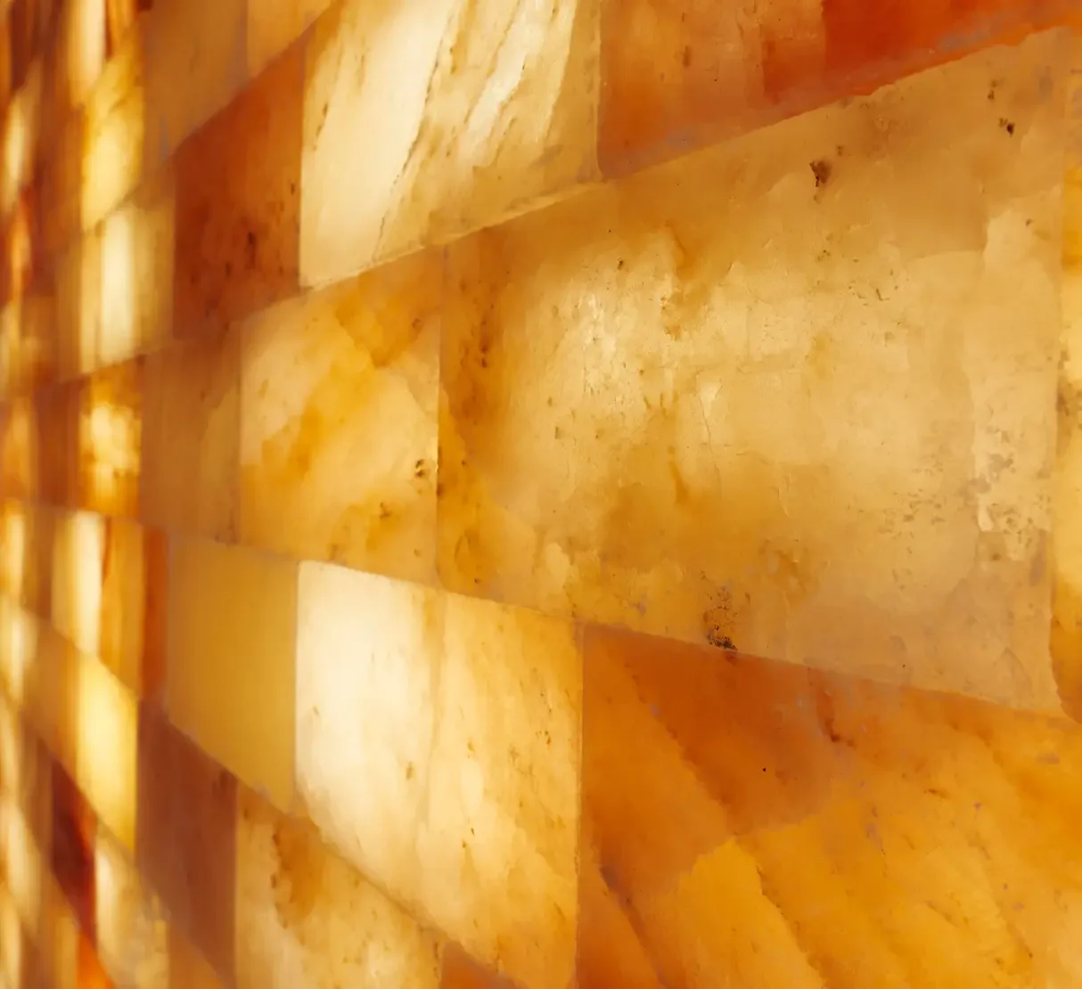 Illuminated Himalayan salt detailing integrated into a treatment room at Champneys Tring