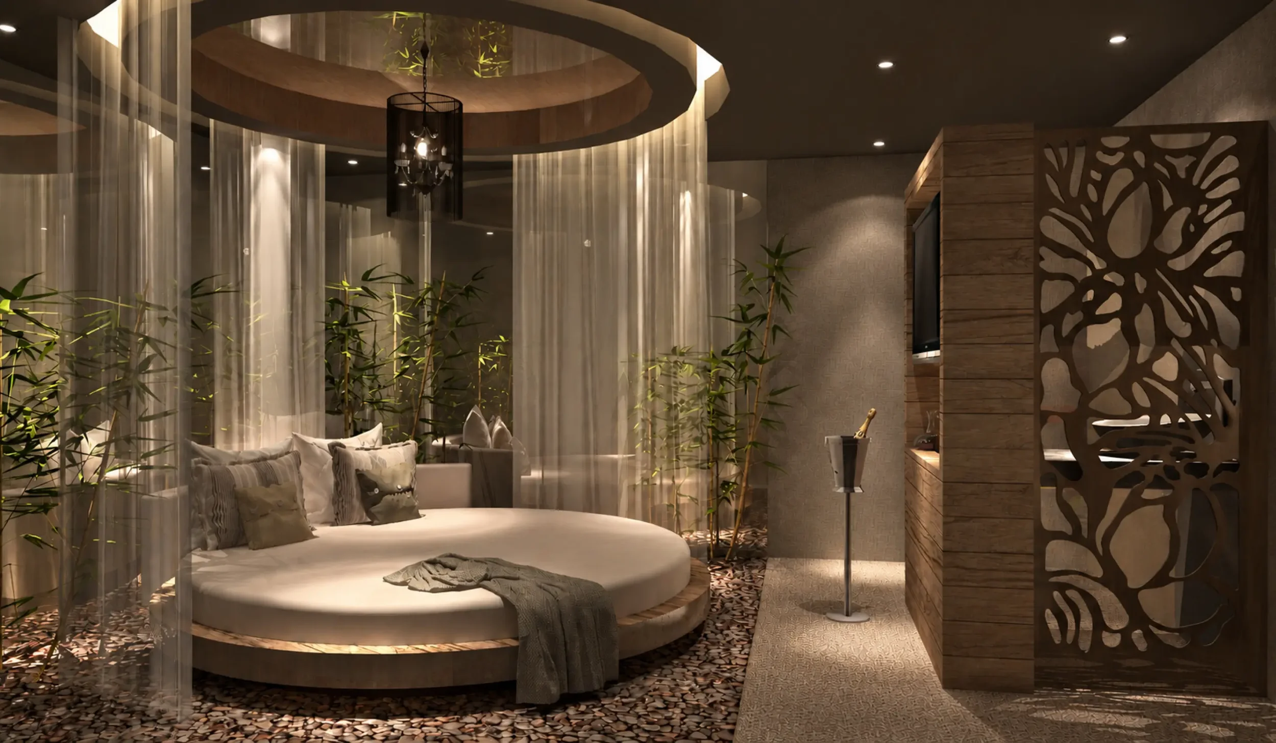 Private spa relaxation pod concept at Champneys Springs featuring a circular daybed, sheer curtains, bamboo planting and natural pebble flooring.
