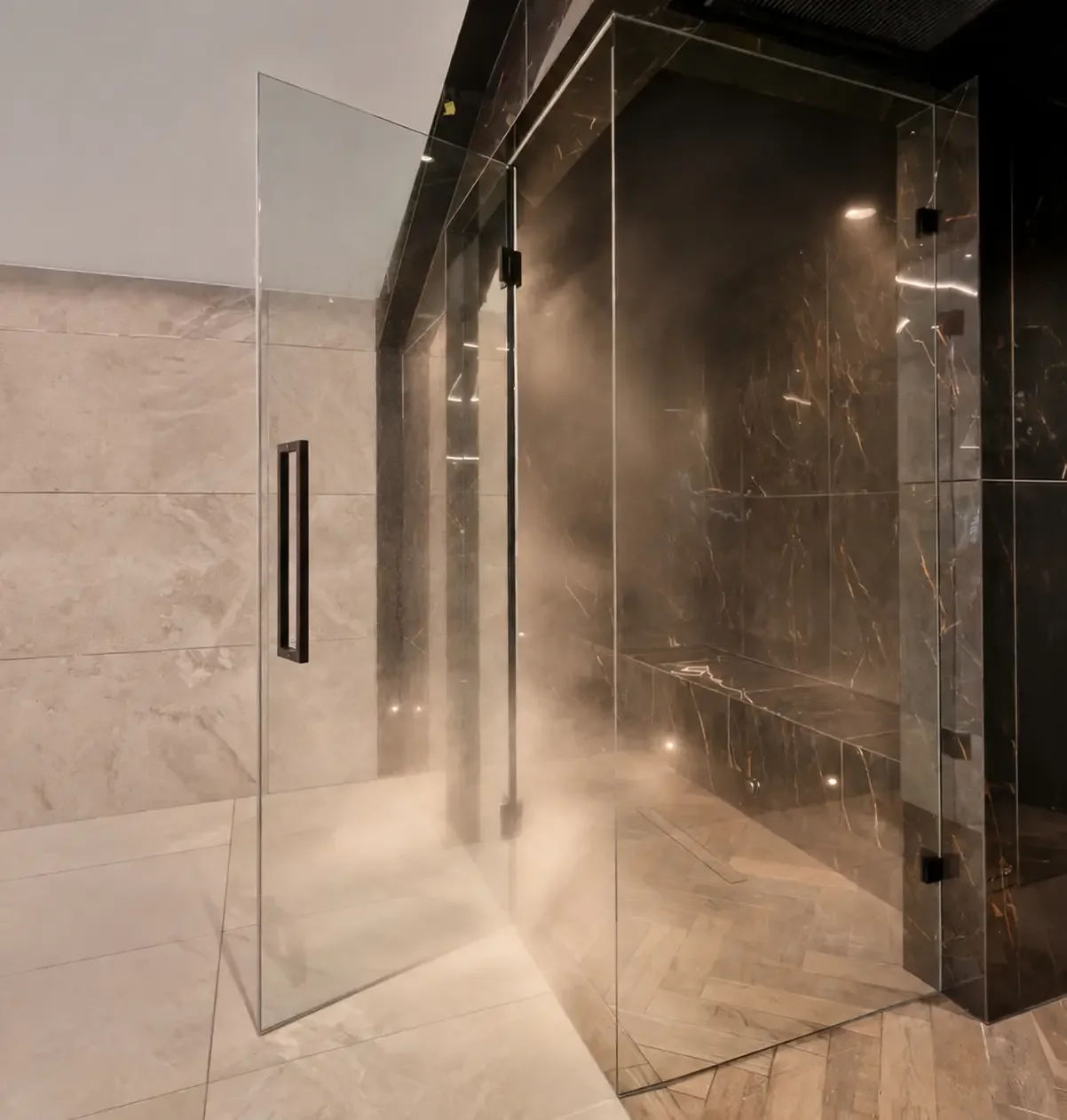 Contemporary sauna within a private residential spa in the New Forest, featuring warm timber finishes, glass doors and atmospheric lighting.