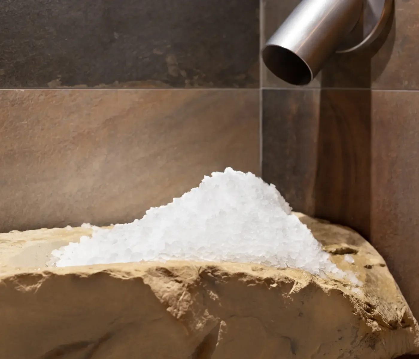 Bespoke ice chute carved from natural stone for contrast therapy at Homefield Grange.