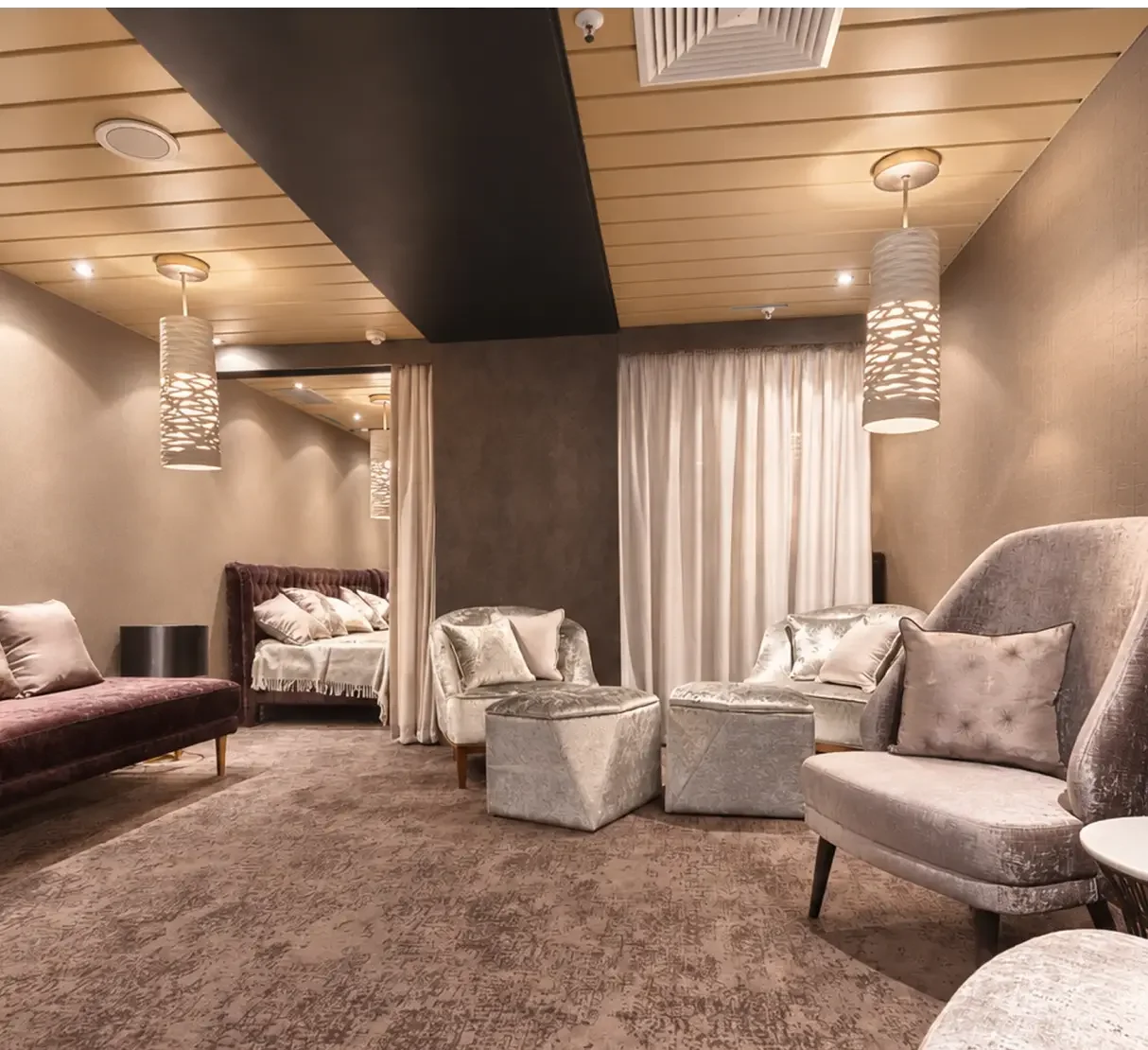 Social relaxation space with comfortable seating and views through the onboard spa.