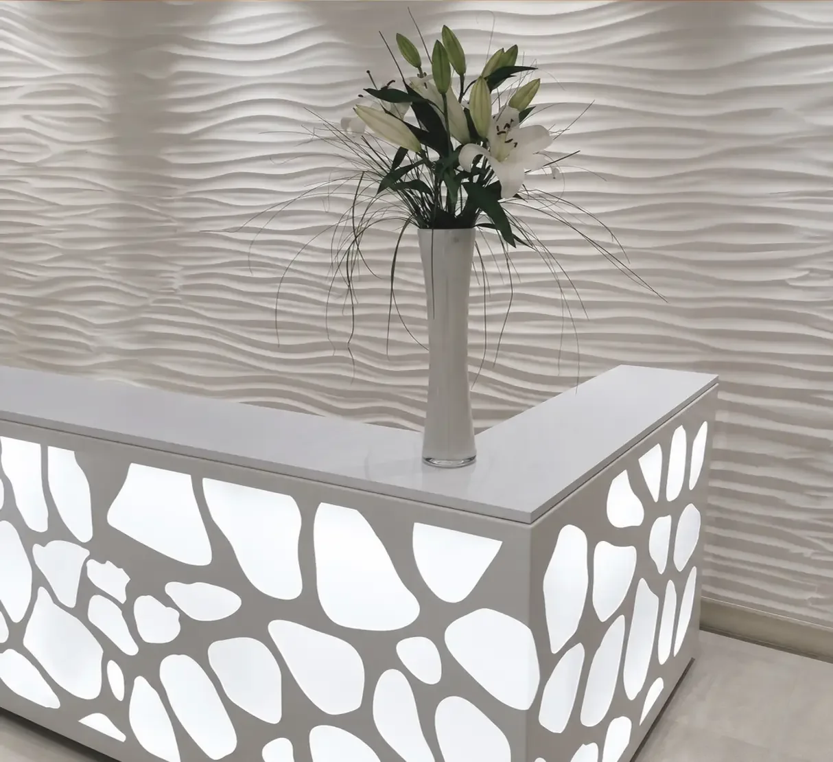 Bespoke illuminated reception desk with cellular detailing at Champneys Tring